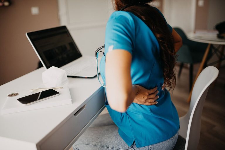 Remote Work Settles Into a Hybrid Compromise An employee working from home on a laptop during a video call